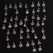 Load image into Gallery viewer, A group of Kathrin Jona &#39;INITIAL&#39; silver letter charms displayed on a black surface, ready to be paired with a matching chain.
