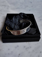 Load image into Gallery viewer, A Kathrin Jona Heavy Silver Cuff bracelet in a black box.
