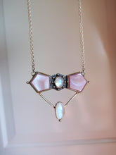 Load image into Gallery viewer, A Kathrin Jona Mother of Pearl Statement Necklace with a pink stone on it.
