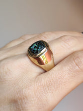Load image into Gallery viewer, A woman&#39;s hand holding a Kathrin Jona Leopard Opal 9k Gold Signet Ring.
