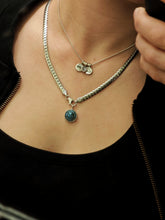 Load image into Gallery viewer, A person wearing a sterling silver chain necklace with a round turquoise pendant and an elegant silver necklace adorned with Kathrin Jona Charm Spacers, exuding charm and sophistication.
