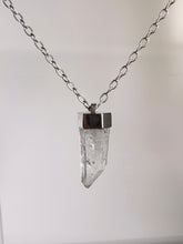 Load image into Gallery viewer, The Australian Clear Quartz Necklace #1 by Kathrin Jona gracefully hangs from a silver chain against a simple white backdrop.
