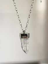 Load image into Gallery viewer, The Australian Clear Quartz Necklace #1 by Kathrin Jona features a clear crystal pendant with a metal cap, elegantly suspended on an Australian silver chain against a plain background.
