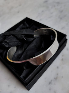 A Heavy Silver Cuff bracelet in a black box by Kathrin Jona.