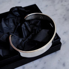 Load image into Gallery viewer, A Heavy Silver Cuff by Kathrin Jona in a black box.
