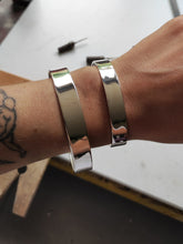 Load image into Gallery viewer, Two adjustable Kathrin Jona Heavy Silver Cuff bracelets on a woman&#39;s wrist.
