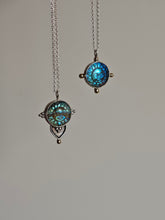 Load image into Gallery viewer, Two Kathrin Jona Fair Labradorite Sun Face Necklaces, crafted from recycled silver with round pendants showcasing blue and green sun designs, hanging against a plain background.
