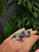 Load image into Gallery viewer, A hand holding a Kathrin Jona Green Shield Turquoise Ring #1.
