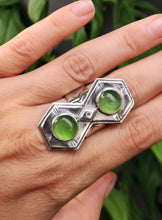 Load image into Gallery viewer, A woman wearing a Green Shield Jadeite Ring #2 with two green stones by Kathrin Jona.
