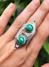 Load image into Gallery viewer, A woman&#39;s hand holding a Kathrin Jona Green Shield Malachite Ring #3.
