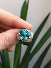 Load image into Gallery viewer, A person holding a Turquoise Cluster Signet Ring by Kathrin Jona.
