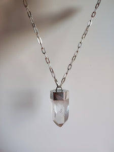 A Clear Quartz Point Statement Necklace by Kathrin Jona on a silver chain.