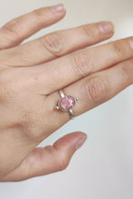 Load image into Gallery viewer, A woman&#39;s hand holding a Rhodochrosite Stacker Ring by Kathrin Jona.
