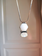 Load image into Gallery viewer, A Mother of Pearl and Moonstone Necklace hanging from a Kathrin Jona silver chain.
