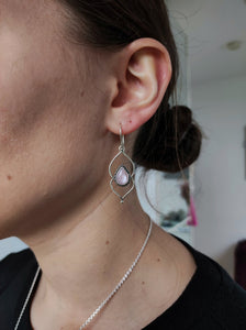 A woman wearing a pair of Kathrin Jona Pink Mother of Pearl Drop Granulation Earrings.