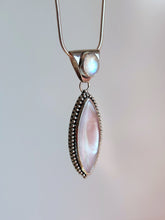 Load image into Gallery viewer, A Mother of Pearl Granulation Necklace with a white stone and a silver chain, made by Kathrin Jona.
