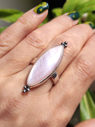A woman wearing a Kathrin Jona Mother of Pearl Ring adjustable.