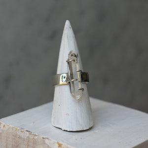 A Clear Quartz Double Point Ring by Kathrin Jona, with a clear quartz stone sitting on top of a cone.