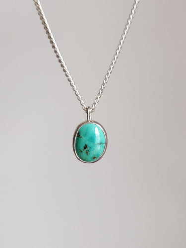 A Kathrin Jona Lil' Turquoise Necklace with a turquoise stone.
