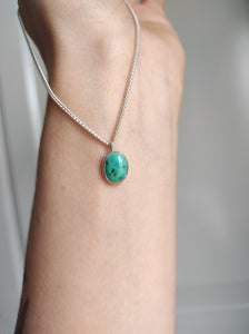 A woman wearing a Lil' Turquoise Necklace from Kathrin Jona.