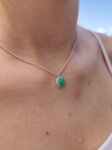 A woman wearing a Lil' Turquoise Necklace by Kathrin Jona.