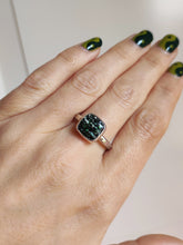 Load image into Gallery viewer, A woman wearing a Leopard Opal Silver Ring M by Kathrin Jona with a green stone.
